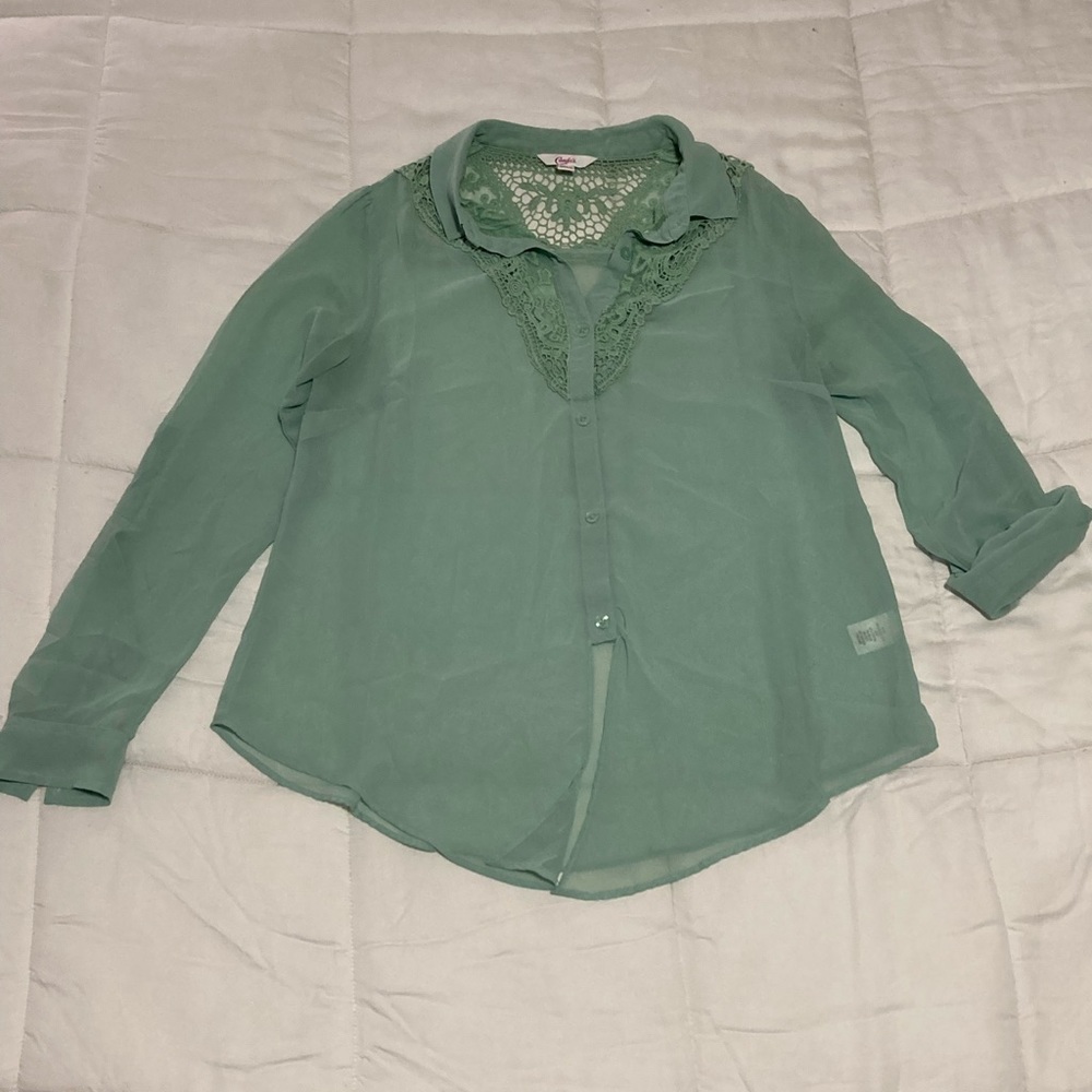 Mint green women’s blouse. See through. Sleeves can be buttoned or rolled up